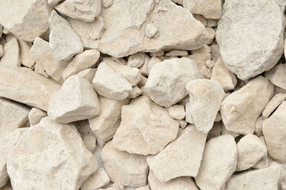 Light-colored gravel and stones in various shapes and sizes for landscaping use.